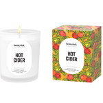Homesick Hot Cider candle and packaging on a white background. Available at Be Charmed. 