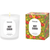 Homesick Hot Cider candle and packaging on a white background. Available at Be Charmed. 