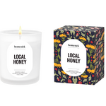 Homesick Local Honey candle and packaging on a white background. Available at Be Charmed. 
