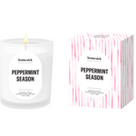 Homesick Peppermint Season candle and packaging on a beige background. Available at Be Charmed. 