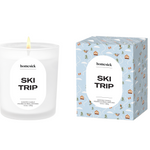 Homesick Ski Trip candle and packaging on a white background. Available at Be Charmed. 