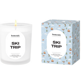 Homesick Ski Trip candle and packaging on a white background. Available at Be Charmed. 