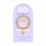 Jilzarah 60th birthday bracelet on a purple card with text. Available at Be Charmed.