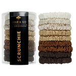 Set of Fawn scrunchies in a 'Grab & Go' container with 'Erickson' branding on a white background. Available at Be Charmed