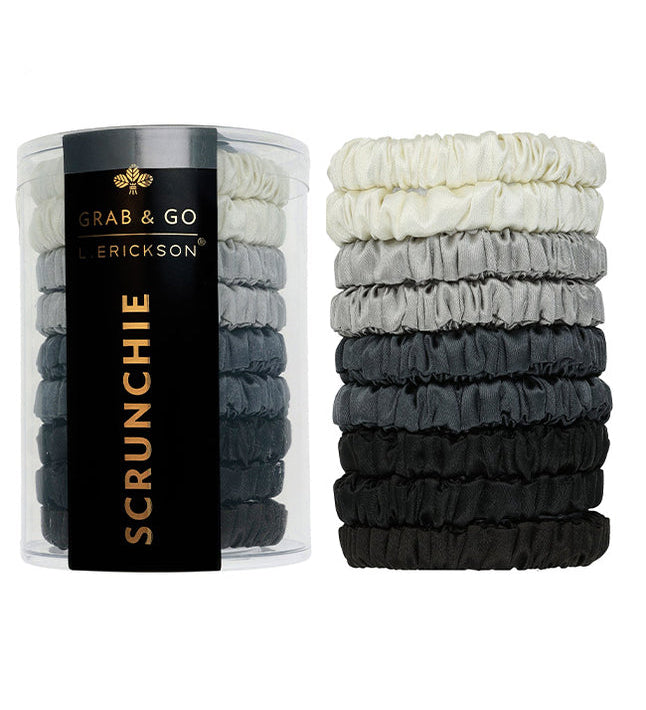 Set of black, gray, and white scrunchies with a container labeled 'Grab & Go Erickson Scrunchie' on a white background. Available at Be Charmed