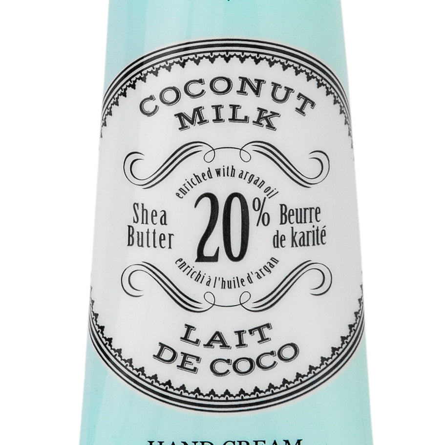 Hand cream tube labeled 'Coconut Milk' with branding on a white background. Available at Be Charmed