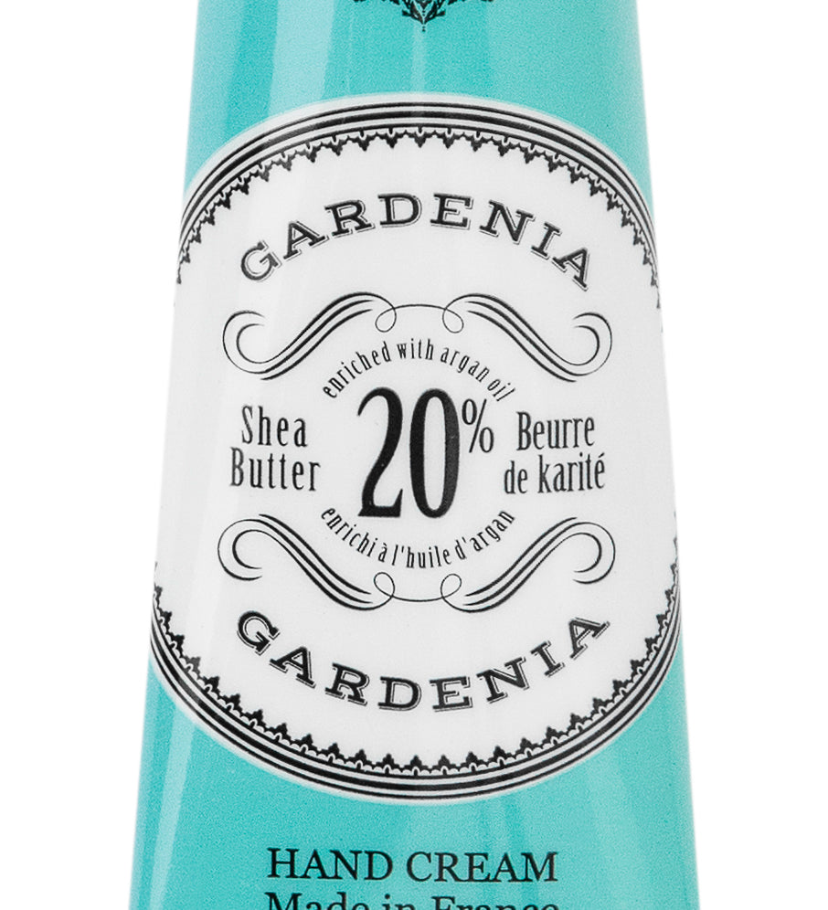 Hand cream tube labeled 'Gardenia' with branding and product details. Available at Be Charmed
