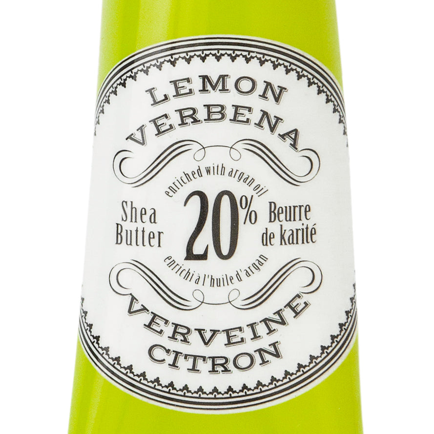 Hand cream tube labeled 'Lemon Verbena' with branding on a white background. Available at Be Charmed