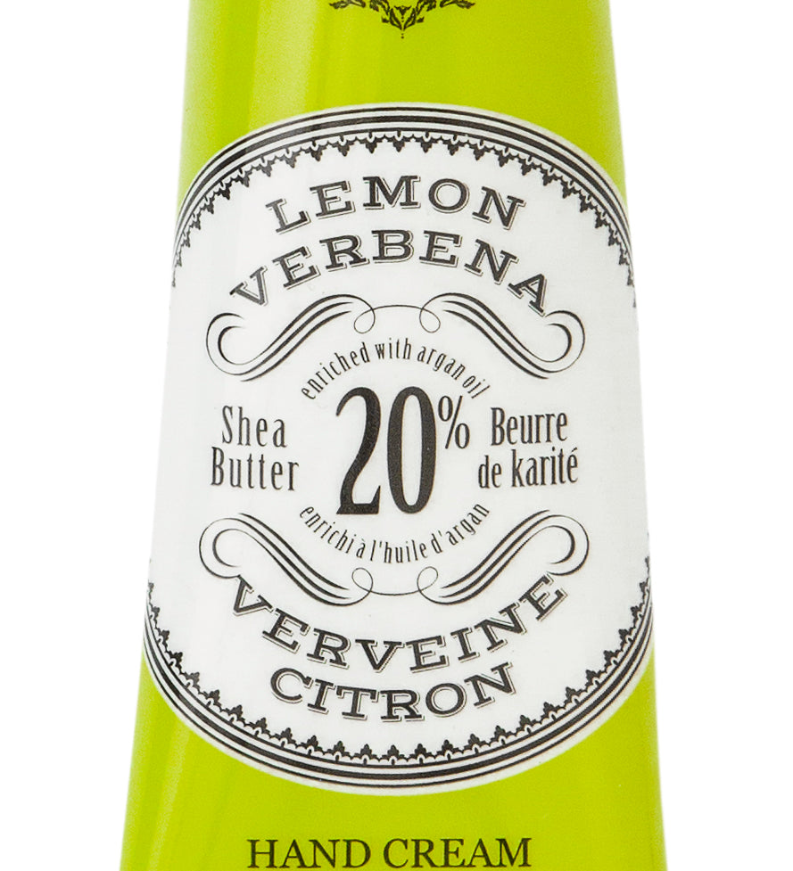 Hand cream tube labeled 'Lemon Verbena' with branding on a white background. Available at Be Charmed