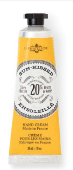Hand cream tube labeled 'Sun-Kissed' by L'Chanteclaire on a white background. Available at Be Charmed