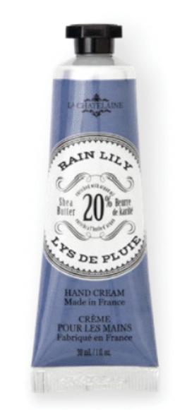 Hand cream tube labeled 'Lys de Pluie' with blue and white packaging on a white background Available at Be Charmed
