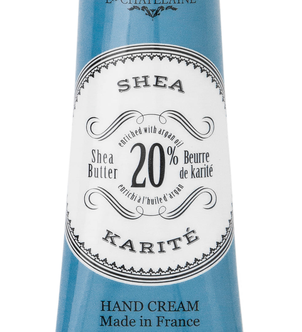 Hand cream tube with blue and white label on a white background. Available at Be Charmed