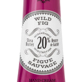 Hand cream tube labeled 'Wild Fig' with branding on a white background. Available at Be Charmed