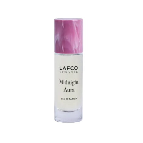 A bottle of LAFCO New York Midnight Aura Eau de Parfum with a white body and a marbled pink cap, set against a plain white background with a soft shadow. Available at Be Chramed