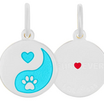 Round white pendants with yin yang design and heart paw print on a white background. Available at Be Charmed. 