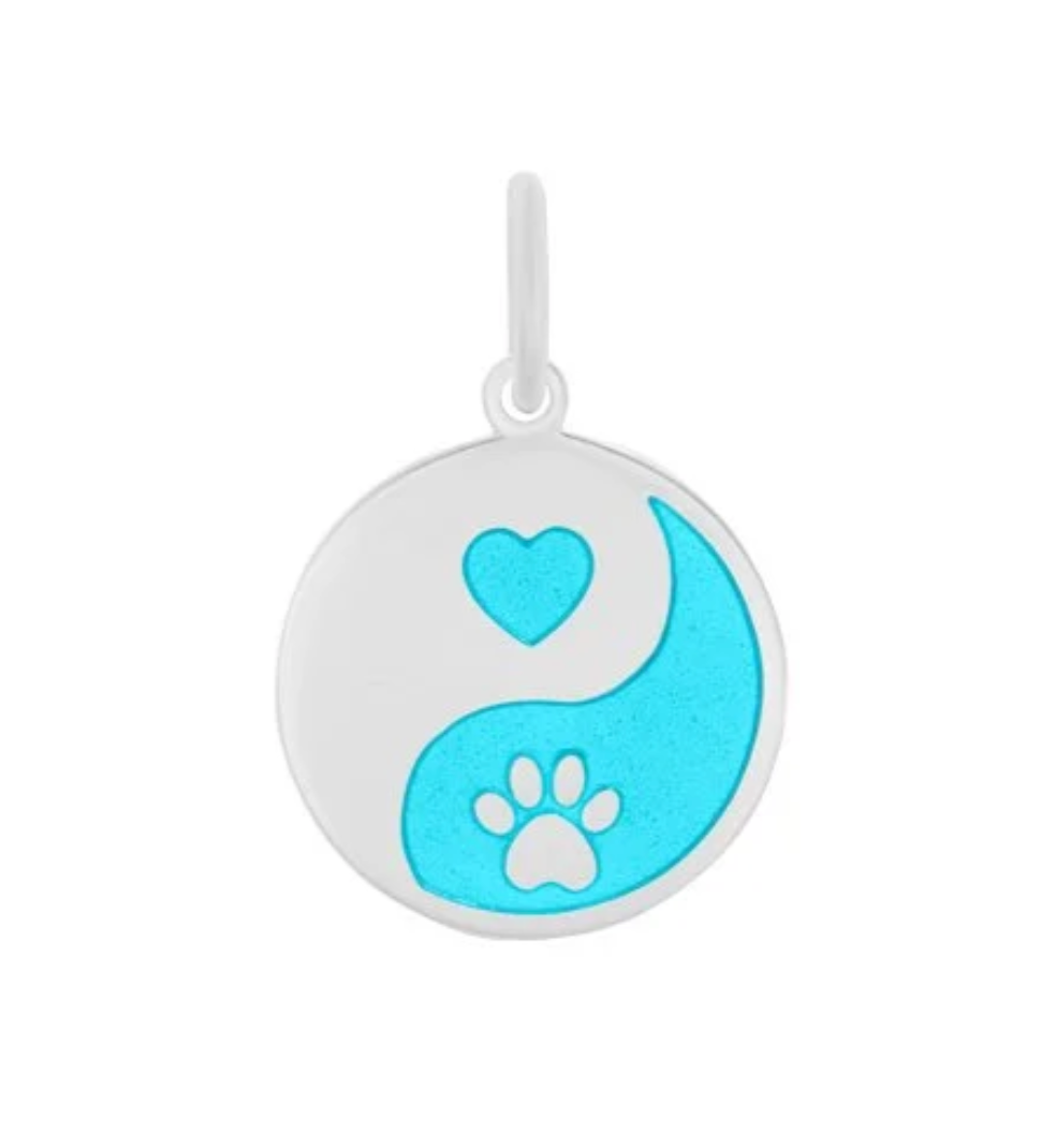 Yin yang symbol with a heart and paw print on a white background. Lola light blue pendant. Available at Be Charmed. 