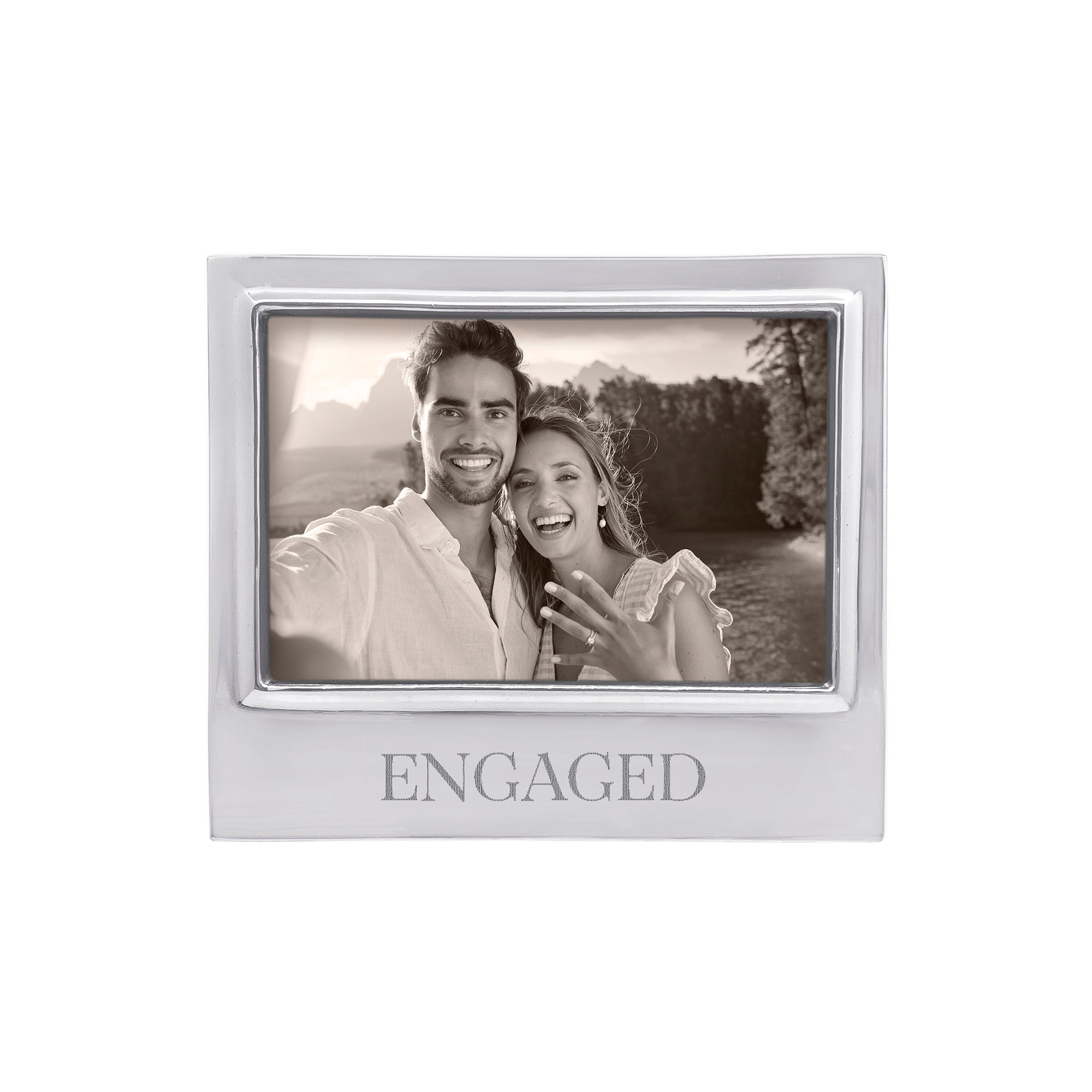 Mariposa silver photo frame with 'ENGAGED' text containing a black and white photo of a couple. This frame makes a great engagement gift, Available at Be Charmed. 