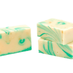 Three blocks of soap with green swirls on a white background. Available at Be Charmed