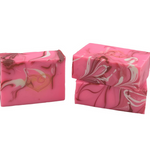Two pink marbled soap bars on a white background. Available at Be Charmed