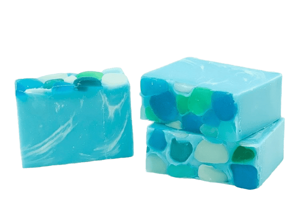 Three bars of blue and green soap with a swirled pattern on a white background> Available at Be Charmed