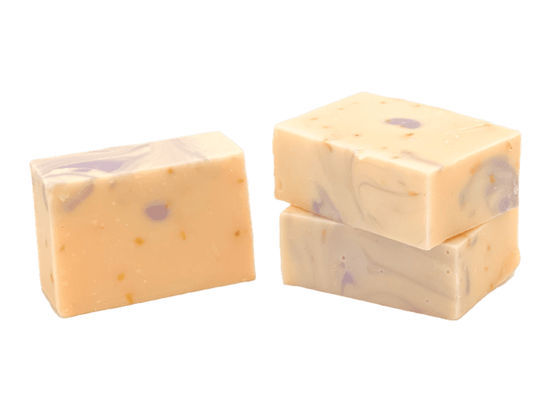 Three bars of Molly's Apothecary bar soap, Lemon Lavender, with a creamy texture and speckled with small flecks. Available at Be Charmed