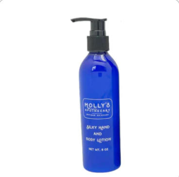 Blue lotion bottle with pump labeled 'Molly's' on a white background. Available at Be Charmed