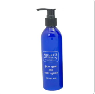 Blue lotion bottle with pump on a white background. Available at Be Charmed