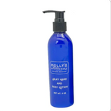 Blue lotion bottle with pump labeled 'Molly's' on a white background. Available at Be Charmed