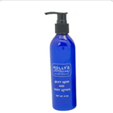 Blue lotion bottle with pump labeled 'Molly's' on a white background. Available at Be Charmed