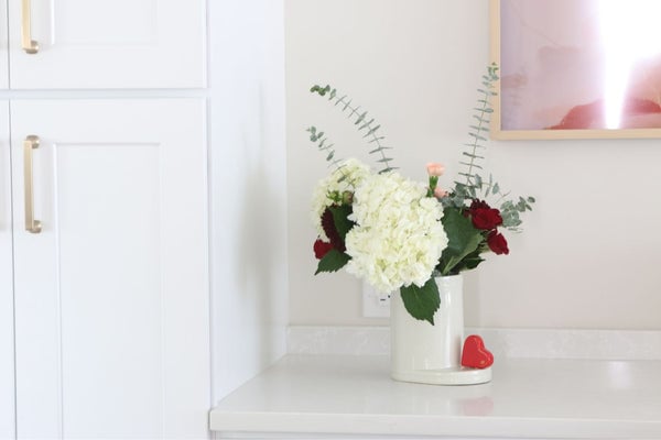 Nora Fleming Be Mine Heart Mini ceramic attachment featuring a red heart design on a dish. Available at Be Charmed.