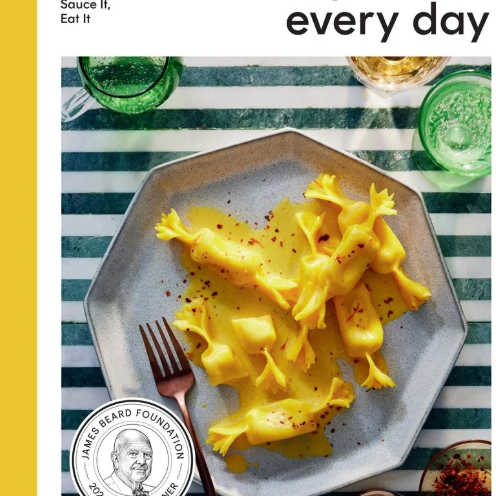 Book cover of 'Pasta Every Day' with a plate of pasta and a glass of green drink on a striped background. Available at Be Charmed