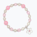 Bracelet with pink and white beads and a flower charm on a white background. Available at Be Charmed