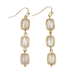 Periwinkle Gold 3 Tier Crystal Drop Earrings featuring three cascading tiers of sparkling faceted crystals in a polished gold setting, available at Be Charmed
