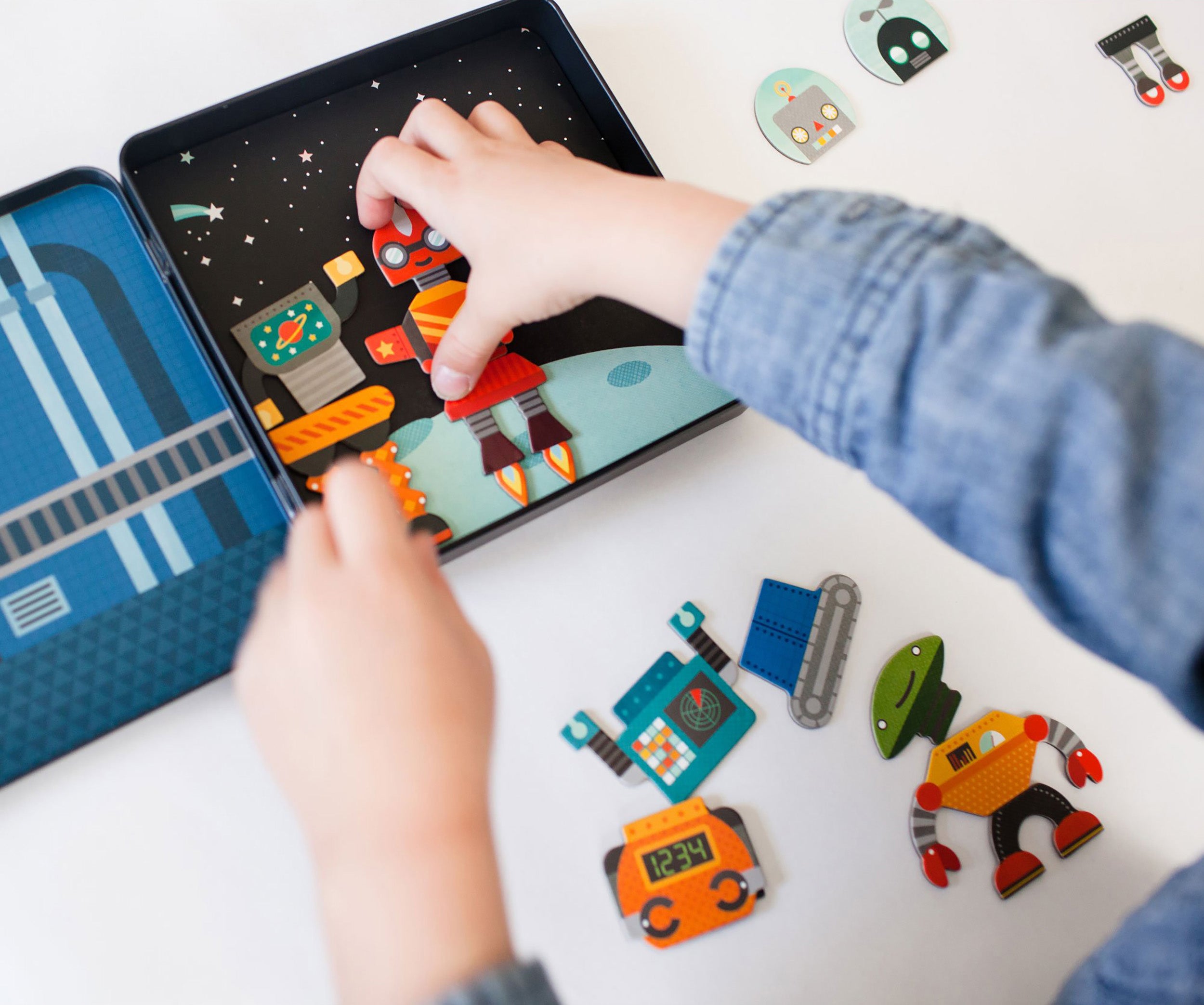 Child playing with magnetic play set