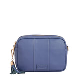 Lupin Blue Pom Pom London City Bag – handcrafted leather crossbody with interchangable straps and London-inspired design. Available at Be Charmed.