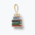 DecorativeRifle Parper Co  ornament shaped like a bookshelf with books and glasses on a white background. Available at Be Charmed