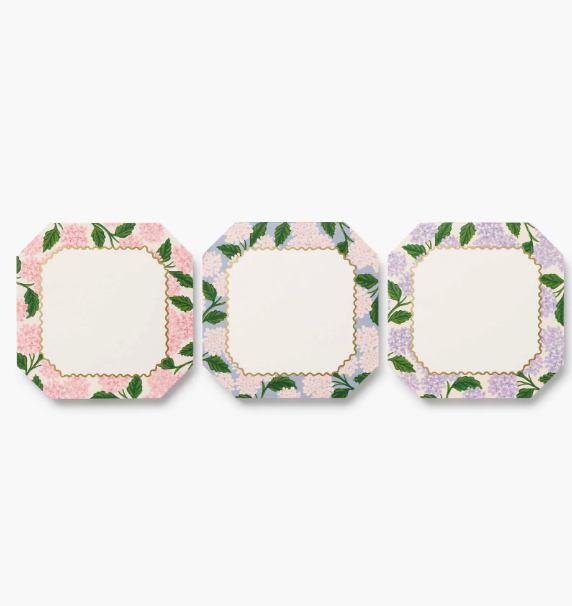 Three octagonal paper notepads with floral borders, arranged horizontally on a light gray background. Available at Be Charmed