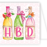 Three colorful bottles with 'HBD' letters on a patterned enclosure card. Available at Be Charmed