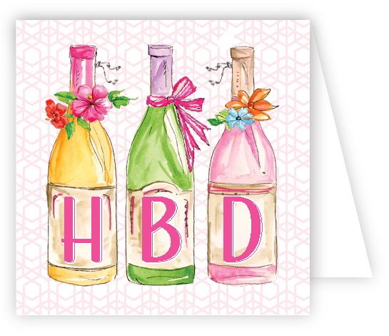 Three colorful bottles with 'HBD' letters on a patterned enclosure card. Available at Be Charmed