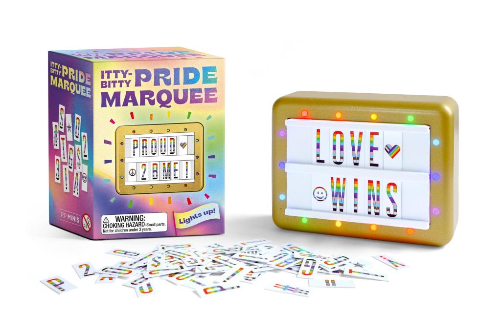Pride-themed light-up marquee with packaging and letters on a white background. Available at Be Charmed