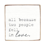 Square block with text 'all because two people fell in love.' on a white background. Available at Be Charmed