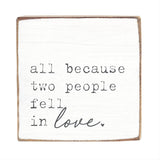 Square block with text 'all because two people fell in love.' on a white background. Available at Be Charmed
