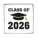 Decorative block with 'Class of 2026' text and a graduation cap design on a white background. Available at Be Charmed