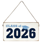 Decorative sign with 'Class of 2026' text and a graduation cap icon on a white background. Available at Be Charmed