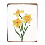 Decorative block with yellow daffodil flowers on a white background. Available at Be Charmed