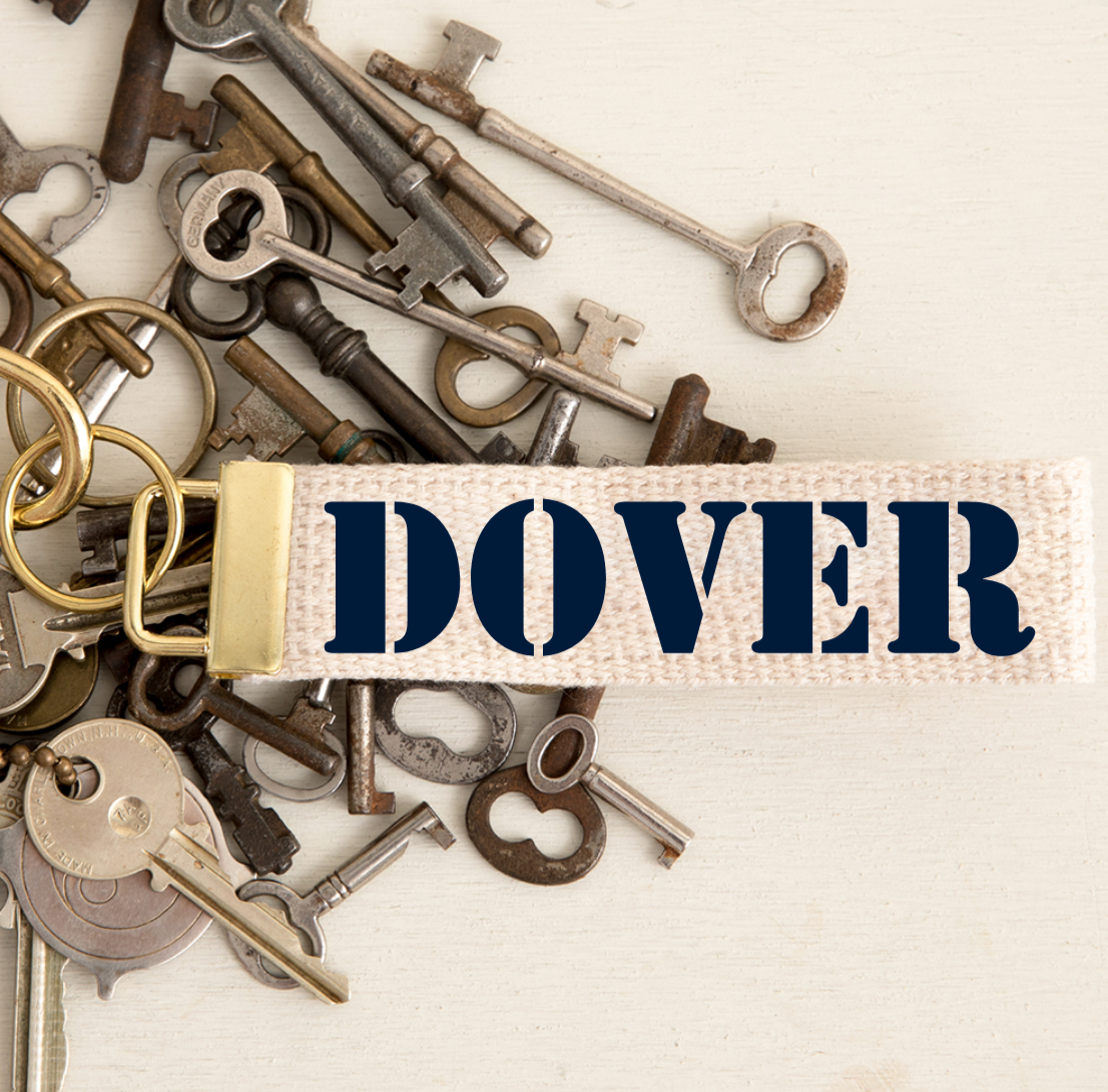 Keychain with 'DOVER' on a background of vintage keys. Available at Be Charmed