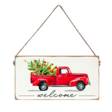 A rustic marlin twine sign with a red truck design and the text 'Welcome' on it, with a white background. Available at Be Charmed
