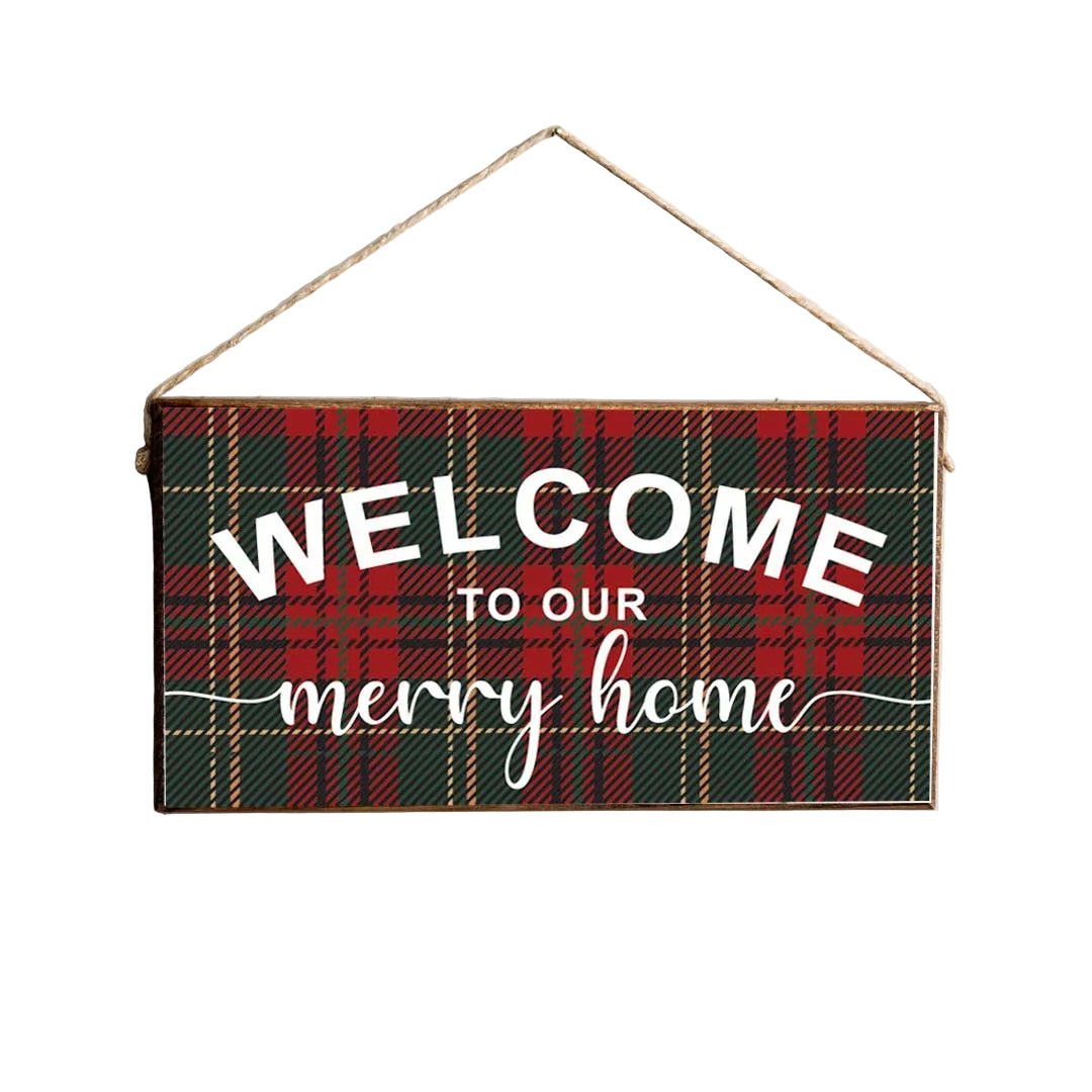 A rustic marlin wooden twine sign with a green and red plaid pattern, featuring the text 'Welcome to our Merry Home'. Available at Be Charmed
