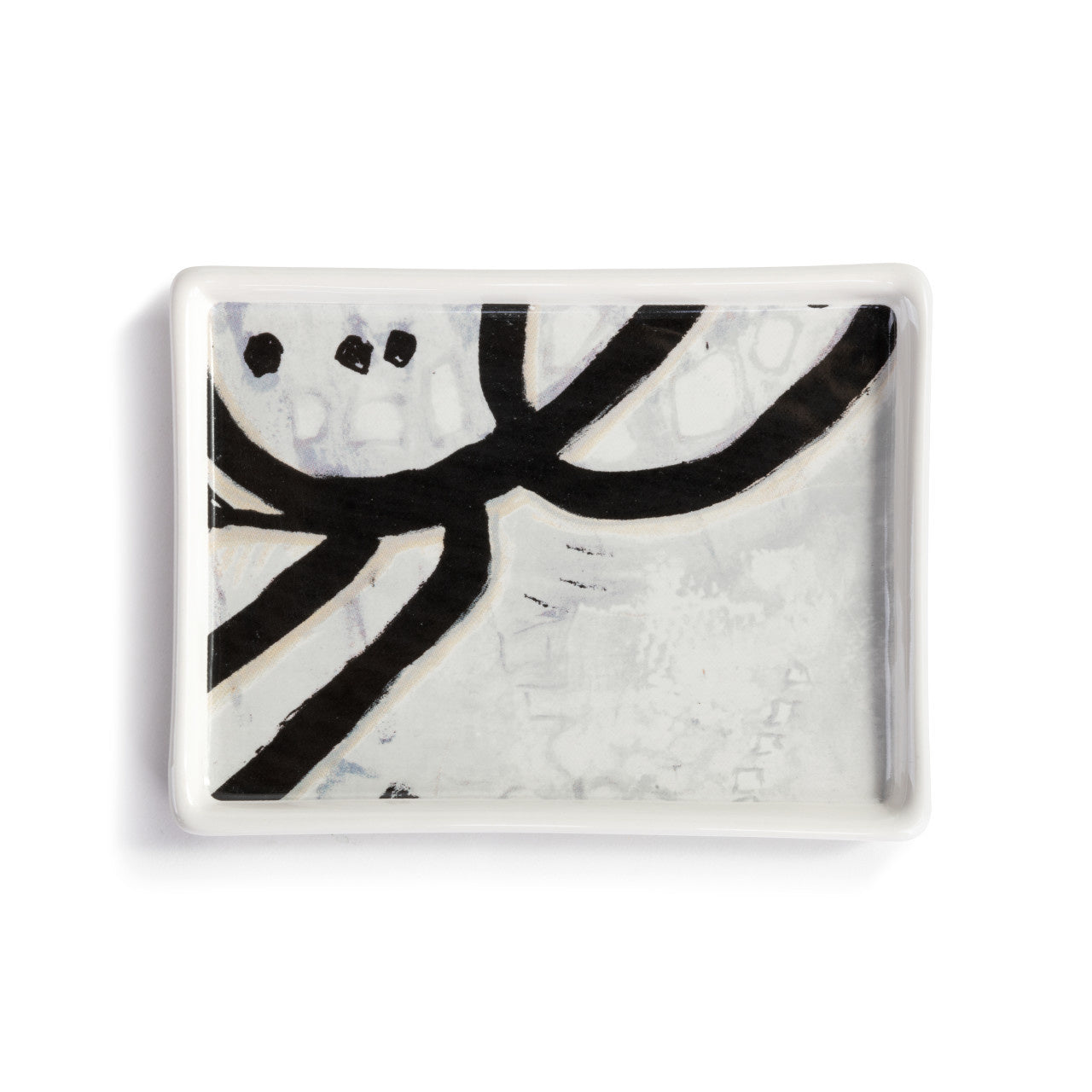 ArtLifting Mini Tray featuring bold black and white abstract artwork on durable stoneware; ideal for jewelry, keys, or décor. A meaningful gift supporting artists from underrepresented communities. Dishwasher and microwave safe. Available at Be Charmed