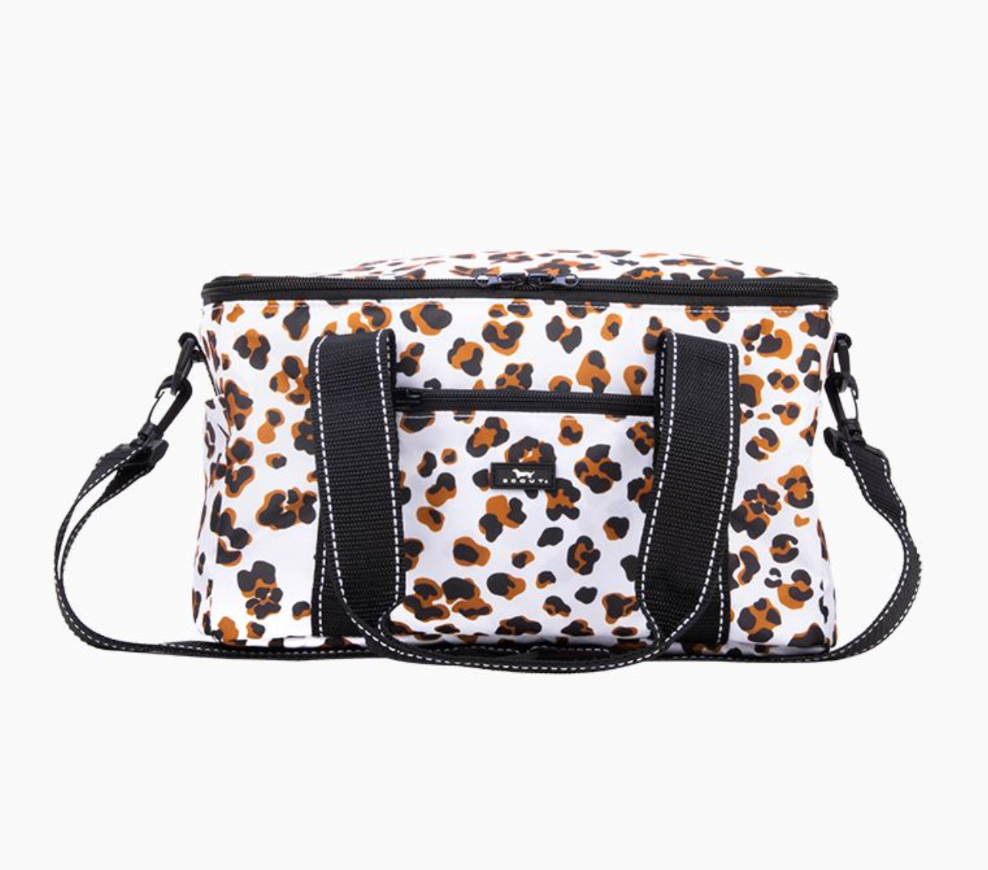 A white insulated cooler bag with a brown and black leopard print pattern, featuring black webbing handles and a matching shoulder strap, shown against a plain white background. Available at Be Charmed